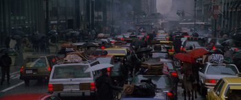 Movie still from “Godzilla” (1998), directed by Roland Emmerich – A bunch of cars that are in the street; Extreme Wide shot, High angle