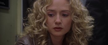 Movie still from “Godzilla” (1998), directed by Roland Emmerich – A person with curly blonde hair; Close Up shot, Low angle