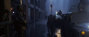 Movie still from “Godzilla” (1998), directed by Roland Emmerich – People walking down a street in the rain; Extreme Wide shot, High angle