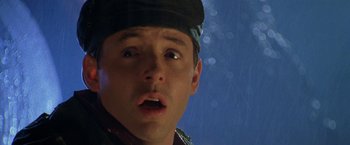 Movie still from “Godzilla” (1998), directed by Roland Emmerich – A person with a hat on; Close Up shot, Low angle