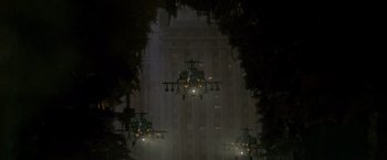 Movie still from “Godzilla” (1998), directed by Roland Emmerich – A group of helicopters flying in the air at night; Extreme Wide shot, Low angle