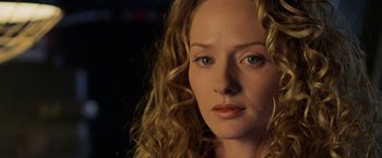 Movie still from “Godzilla” (1998), directed by Roland Emmerich – A person with curly hair; Close Up shot, Over the shoulder angle