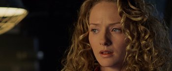 Movie still from “Godzilla” (1998), directed by Roland Emmerich – A person with curly hair; Close Up shot, Over the shoulder angle