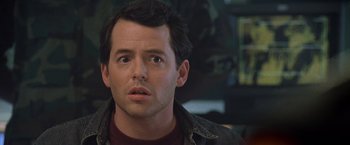 Movie still from “Godzilla” (1998), directed by Roland Emmerich – A person looking at the camera; Close Up shot, Over the shoulder angle