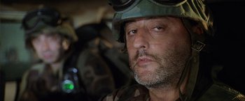 Movie still from “Godzilla” (1998), directed by Roland Emmerich – A person wearing a helmet; Close Up shot, Over the shoulder angle