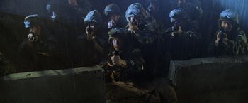 Movie still from “Godzilla” (1998), directed by Roland Emmerich – A group of men in military fatigues and helmets; Wide shot, High angle