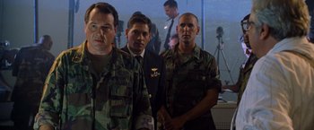 Movie still from “Godzilla” (1998), directed by Roland Emmerich – A group of men standing next to each other in camouflage uniforms; Medium shot, Low angle
