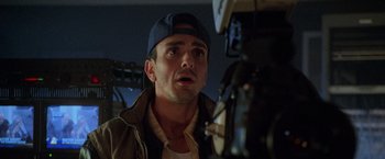 Movie still from “Godzilla” (1998), directed by Roland Emmerich – A person wearing a hat; Close Up shot, Low angle