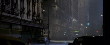 Movie still from “Godzilla” (1998), directed by Roland Emmerich – A car parked on the side of the road at night; Extreme Wide shot, High angle