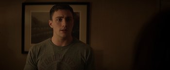 Movie still from “Godzilla” (2014), directed by Gareth Edwards – A man in a grey shirt is standing in a room; Close Up shot, Over the shoulder angle