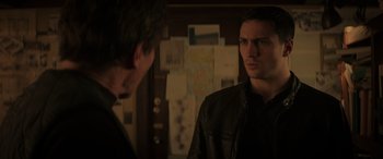 Movie still from “Godzilla” (2014), directed by Gareth Edwards – A man in a leather jacket talking to another man in a leather jacket; Close Up shot, Over the shoulder angle