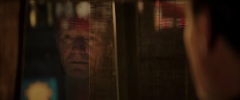 Movie still from “Godzilla” (2014), directed by Gareth Edwards – A man looking out of a window at night; Extreme Close Up shot, Low angle