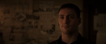 Movie still from “Godzilla” (2014), directed by Gareth Edwards – A person in a dark room; Close Up shot, Over the shoulder angle