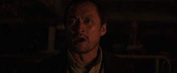 Movie still from “Godzilla” (2014), directed by Gareth Edwards – A person with his mouth wide open; Close Up shot, Low angle