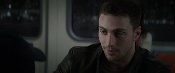 Movie still from “Godzilla” (2014), directed by Gareth Edwards – A person wearing a leather jacket; Close Up shot, Over the shoulder angle