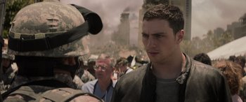 Movie still from “Godzilla” (2014), directed by Gareth Edwards – A group of men standing around a building; Close Up shot, Over the shoulder angle