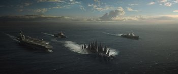 Movie still from “Godzilla” (2014), directed by Gareth Edwards – An island in the middle of the ocean surrounded by waves; Extreme Wide shot, High angle