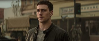 Movie still from “Godzilla” (2014), directed by Gareth Edwards – A person wearing a leather jacket; Close Up shot, Over the shoulder angle