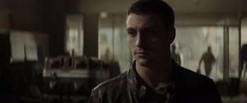 Movie still from “Godzilla” (2014), directed by Gareth Edwards – A person wearing a leather jacket; Close Up shot, Low angle