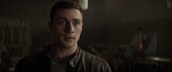 Movie still from “Godzilla” (2014), directed by Gareth Edwards – A person wearing a leather jacket; Close Up shot, Over the shoulder angle