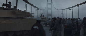 Movie still from “Godzilla” (2014), directed by Gareth Edwards – A group of people walking across a bridge in the rain; Extreme Wide shot, Low angle