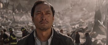 Movie still from “Godzilla” (2014), directed by Gareth Edwards – A person wearing a jacket; Close Up shot, Low angle