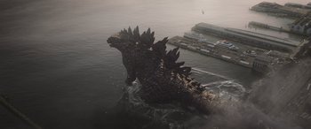Movie still from “Godzilla” (2014), directed by Gareth Edwards – A giant godzilla is in the middle of the ocean; Extreme Wide shot, High angle
