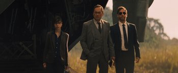 Movie still from “Godzilla: King of the Monsters” (2019), directed by Michael Dougherty – A group of men standing next to each other; Medium shot, Low angle