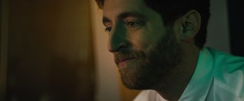 Movie still from “Godzilla: King of the Monsters” (2019), directed by Michael Dougherty – A person with a beard; Close Up shot, Low angle