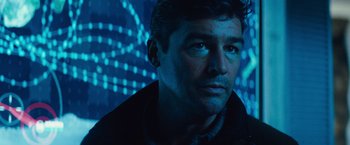 Movie still from “Godzilla: King of the Monsters” (2019), directed by Michael Dougherty – A person wearing a black jacket; Close Up shot, Low angle