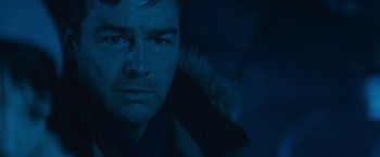 Movie still from “Godzilla: King of the Monsters” (2019), directed by Michael Dougherty – A man's face in the dark; Close Up shot, Low angle