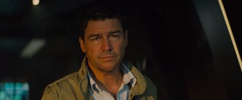 Movie still from “Godzilla: King of the Monsters” (2019), directed by Michael Dougherty – A person wearing a jacket; Close Up shot, Low angle