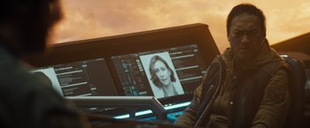 Movie still from “Godzilla: King of the Monsters” (2019), directed by Michael Dougherty – A computer screen showing a picture of a woman; Close Up shot, Over the shoulder angle