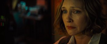 Movie still from “Godzilla: King of the Monsters” (2019), directed by Michael Dougherty – A person looking at the camera; Close Up shot, Over the shoulder angle