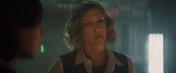 Movie still from “Godzilla: King of the Monsters” (2019), directed by Michael Dougherty – A person with short hair; Close Up shot, Over the shoulder angle