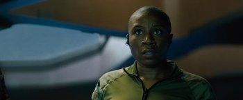 Movie still from “Godzilla: King of the Monsters” (2019), directed by Michael Dougherty – A person with a headset on looking up; Close Up shot, Low angle