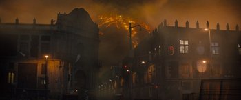 Movie still from “Godzilla: King of the Monsters” (2019), directed by Michael Dougherty – A large fire is burning in the sky; Extreme Wide shot, Low angle