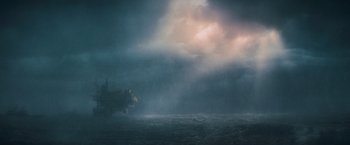 Movie still from “Godzilla: King of the Monsters” (2019), directed by Michael Dougherty – A ship in the middle of the ocean under a cloudy sky; Extreme Wide shot, Low angle