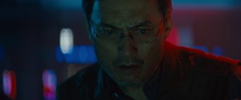 Movie still from “Godzilla: King of the Monsters” (2019), directed by Michael Dougherty – A person wearing glasses; Close Up shot, Low angle
