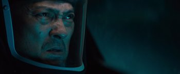 Movie still from “Godzilla: King of the Monsters” (2019), directed by Michael Dougherty – A person in a space helmet; Close Up shot, Over the shoulder angle