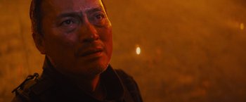 Movie still from “Godzilla: King of the Monsters” (2019), directed by Michael Dougherty – A person looking at the camera; Close Up shot, Low angle