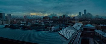 Movie still from “Godzilla: King of the Monsters” (2019), directed by Michael Dougherty – A view of a city from the roof of an apartment building; Extreme Wide shot, High angle