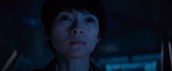 Movie still from “Godzilla: King of the Monsters” (2019), directed by Michael Dougherty – A person's face in the dark; Close Up shot, Low angle