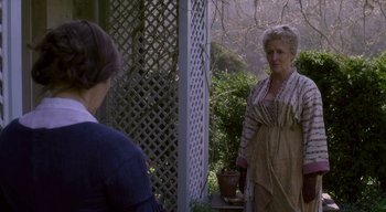 Movie still from “Ammonite” (2020), directed by Francis Lee – Two women standing in front of each other outside; Medium shot, Over the shoulder angle