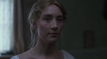 Movie still from “Ammonite” (2020), directed by Francis Lee – A person wearing a white shirt; Close Up shot, Over the shoulder angle