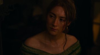 Movie still from “Ammonite” (2020), directed by Francis Lee – A person wearing a green dress; Close Up shot, High angle