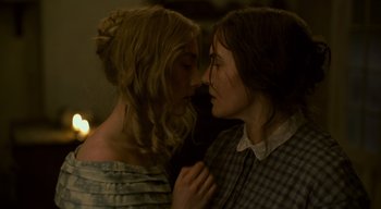 Movie still from “Ammonite” (2020), directed by Francis Lee – Two women are kissing each other on the cheek; Close Up shot, Over the shoulder angle