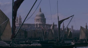 Movie still from “Ammonite” (2020), directed by Francis Lee – A view of a city from across the river; Extreme Wide shot, High angle