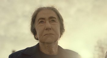 Movie still from “Golda” (2023), directed by Guy Nattiv – An older woman looking up into the sky; Close Up shot, Low angle