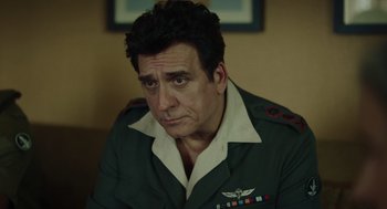 Movie still from “Golda” (2023), directed by Guy Nattiv – A person wearing a uniform; Close Up shot, Low angle